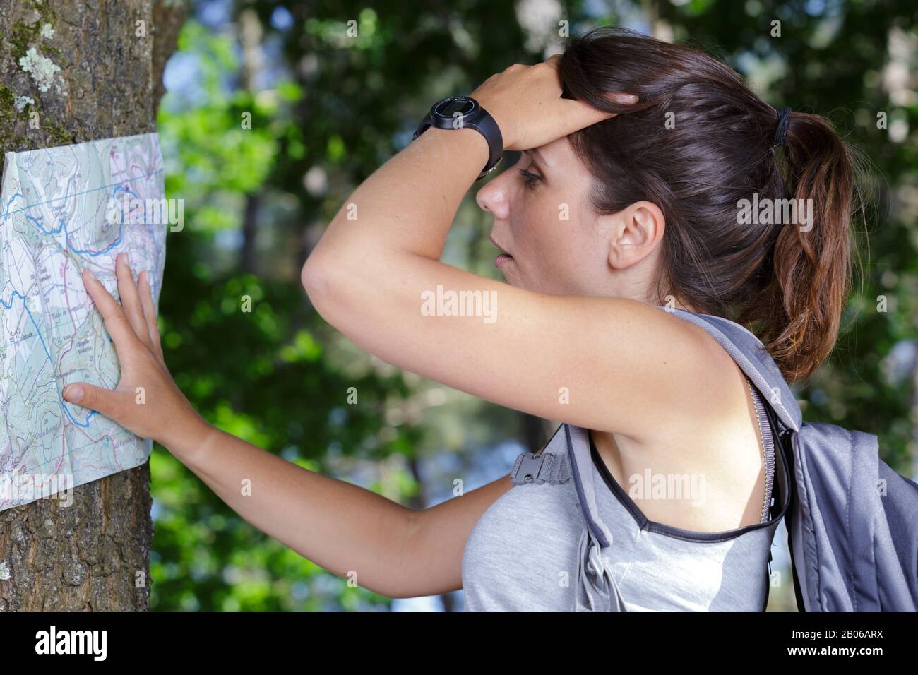 female hiker deciding which path to take Stock Photo