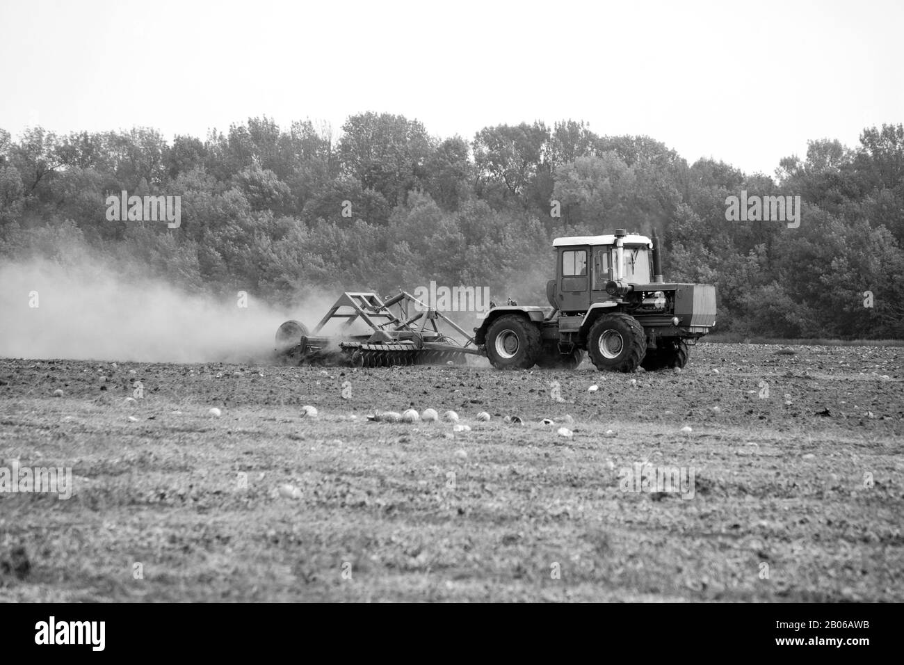 Tractor sowing in field wheat Black and White Stock Photos & Images - Alamy