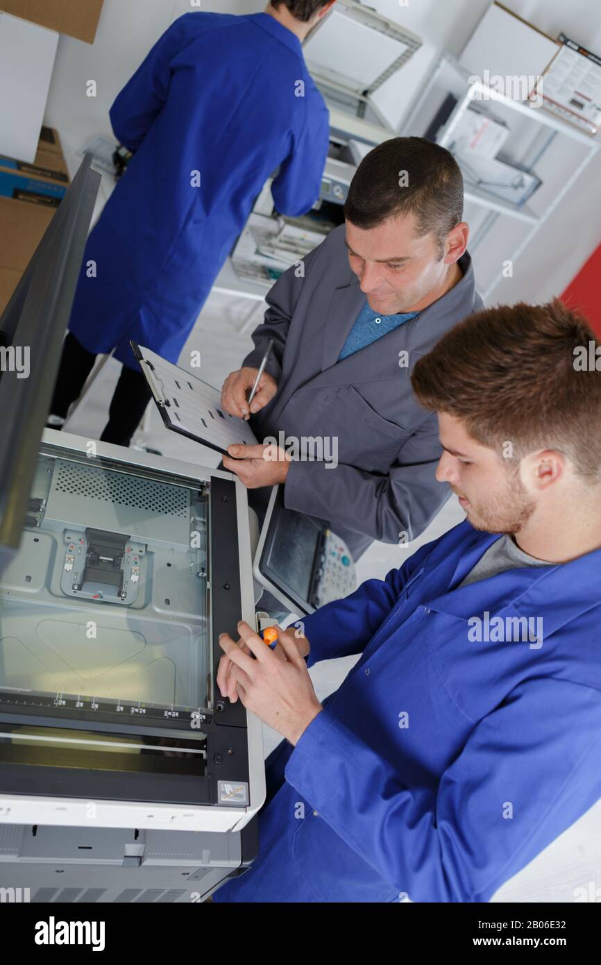 Printer with apprentice hi-res stock photography and images - Alamy