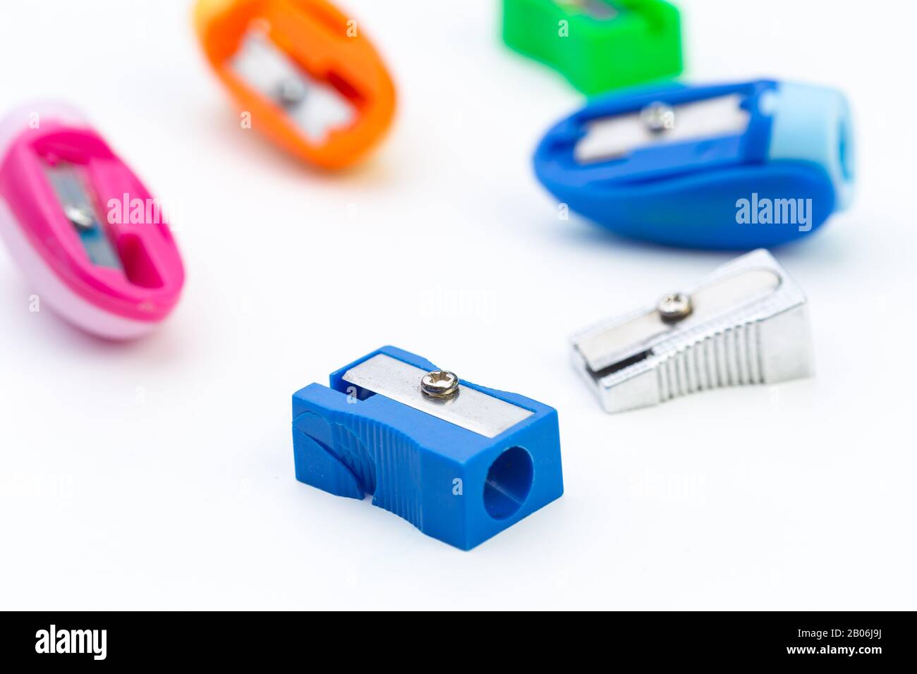 different colors sharpener isolated on white background Stock Photo - Alamy