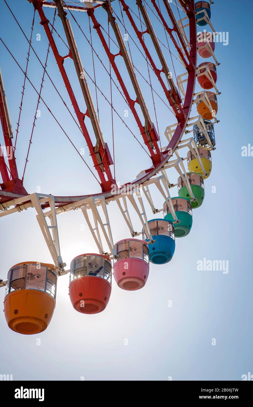 Colorful gondolas in front of a blue sky, Daikanransha Ferris wheel, backlight shot, Palette Town, Odaiba, Tokyo, Japan Stock Photo
