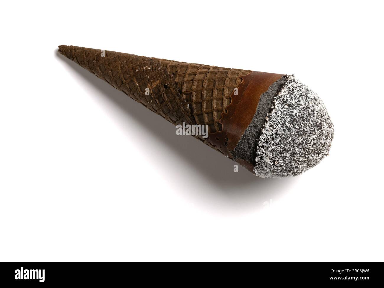 black color ice cream cone with shredded coconut on white background ...