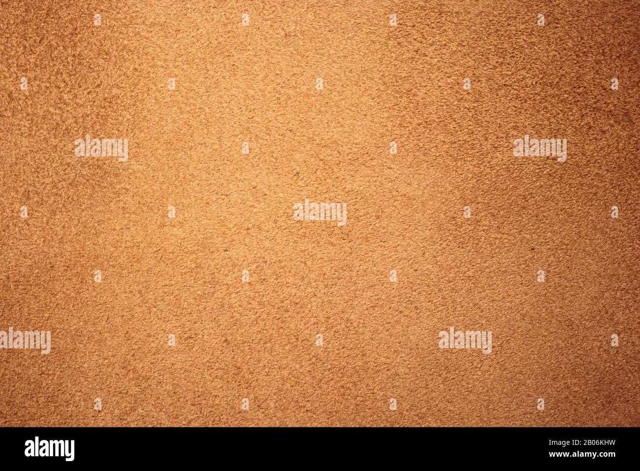 Chamois texture, light brown suede. Shabby leather background, natural skin pattern. Rough fabric surface Stock Photo