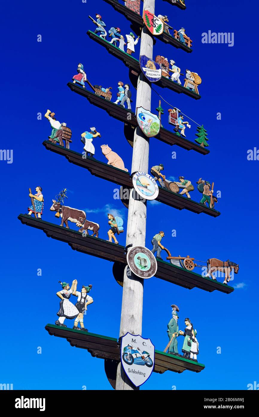 Maypole with guild sign in Schleching, Chiemgau, Upper Bavaria, Bavaria ...