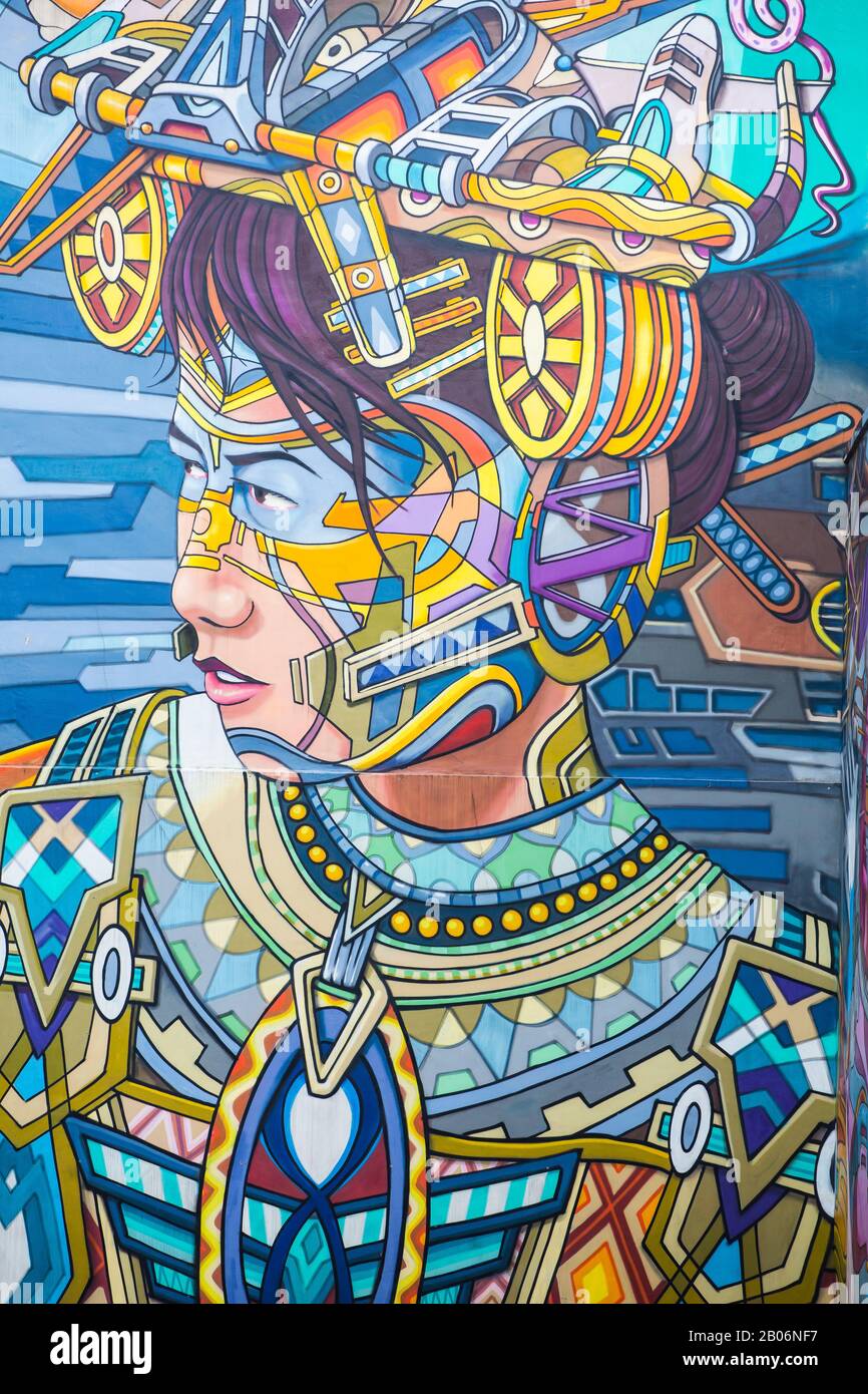 Beautiful wall mural paintings on a large wall behind Haji Lane