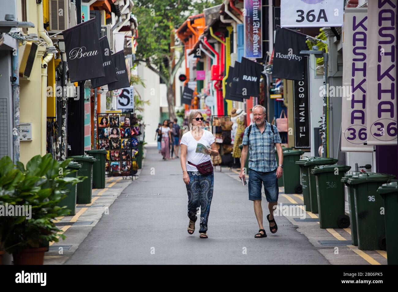 2 caucasian travellers strolling along the quiet street of Haji Lane in the morning. Singapore Stock Photo