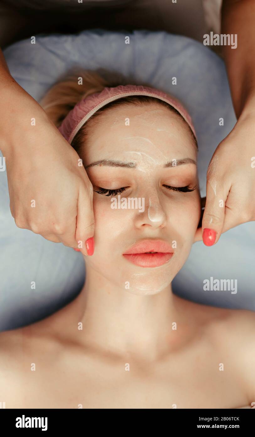face massage on woman in the spa salon Stock Photo Alamy