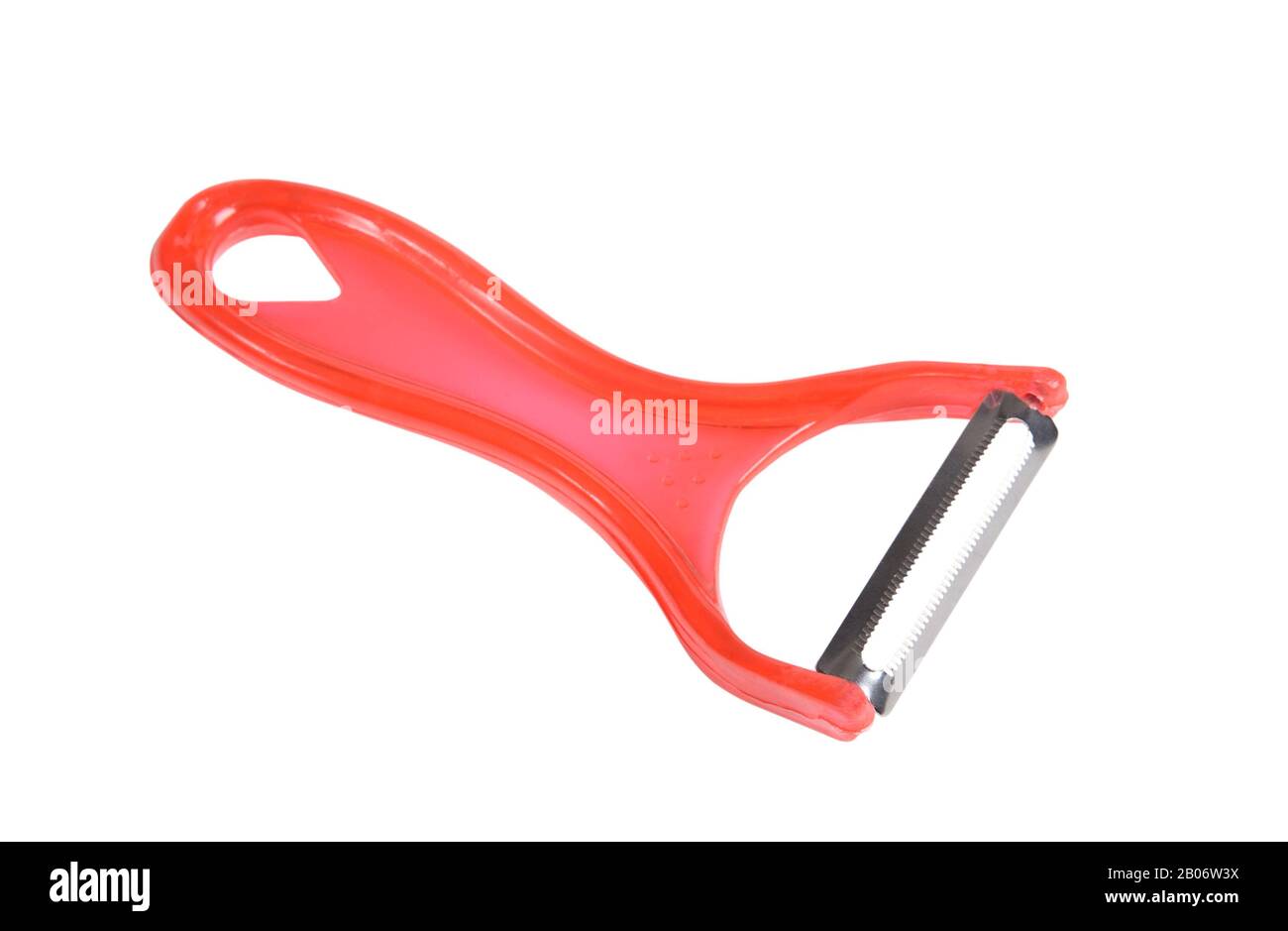 Red plastic peeler for vegetables and fruits isolated on white background Stock Photo