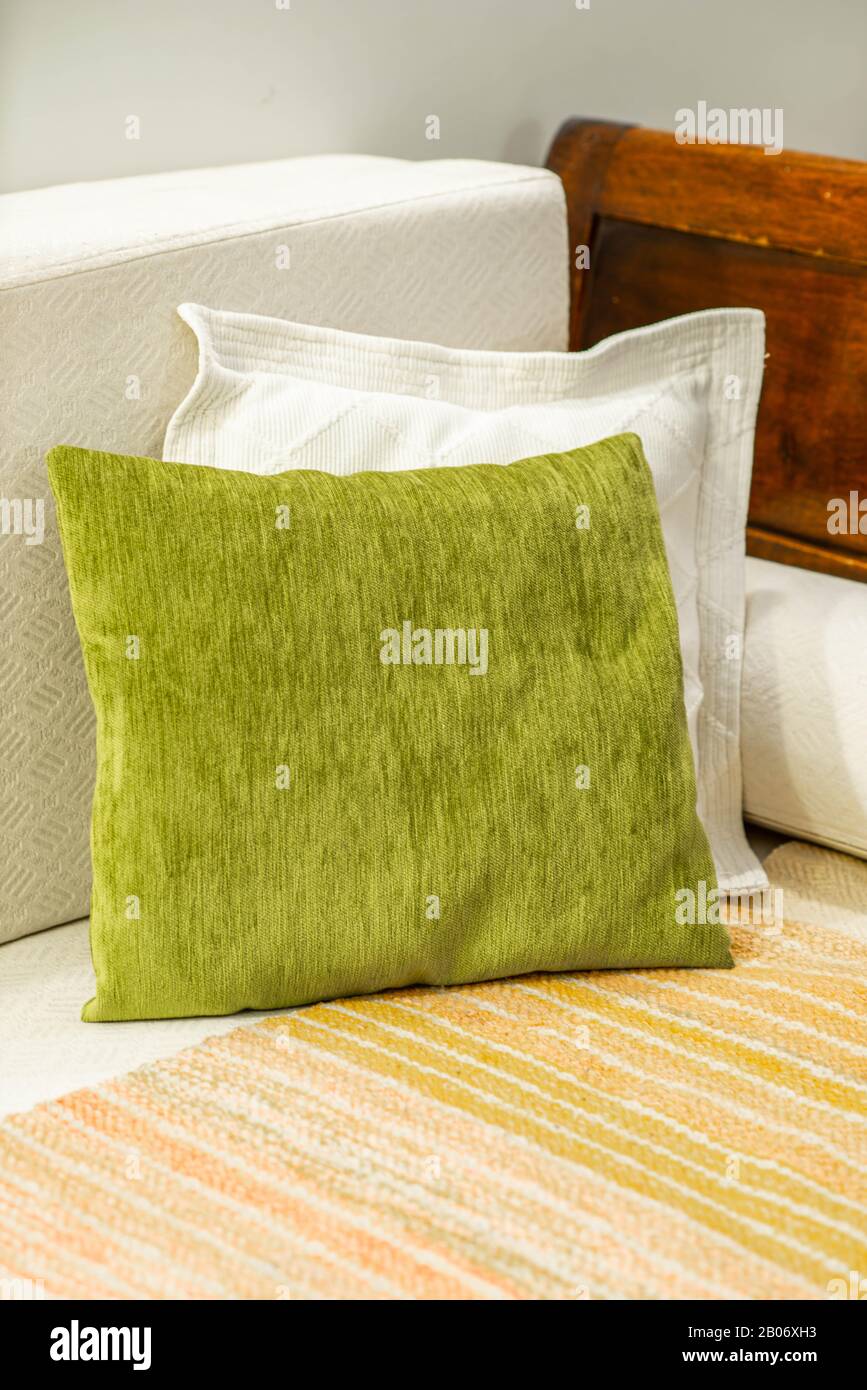Close-up of couple of decorative pillows on the sofa in interior. Stock Photo