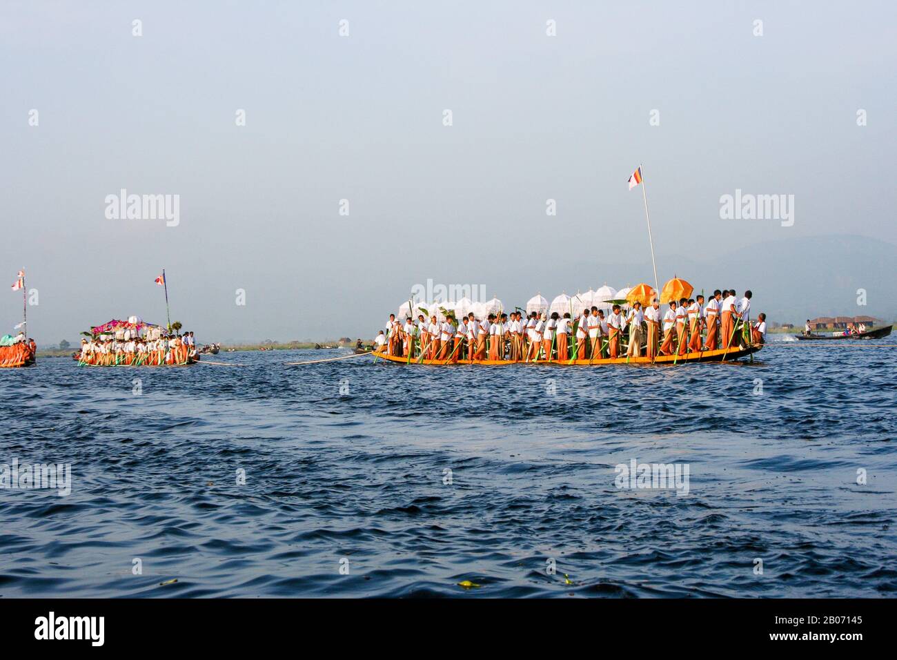 Traditional rowing boat in Burma (rowers push rowing with their feet) Inle Lake Stock Photo