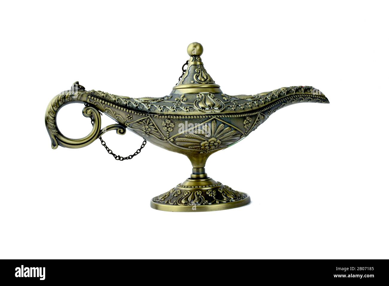 Magical genie lamp of aladdin,a antique golden colored lamp displayed on a  white background Stock Photo - Alamy