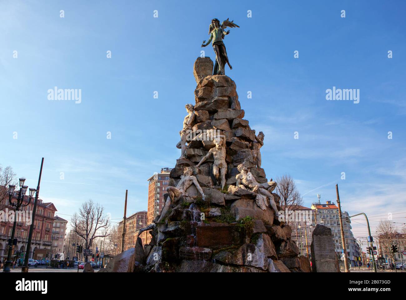 Dramatic monument of winged angel at Piazza statuto in Turin Stock Photo