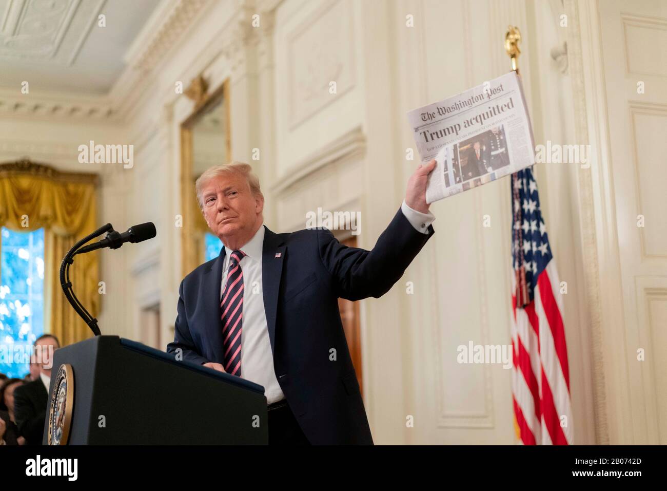 USA Washington DC -- 06 Feb 2020 -- President Donald J Trump holds up a copy of the Washington Post newspaper with a headline saying 'Trump acquitted' Stock Photo
