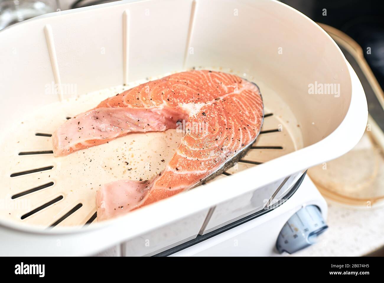 Cooking process, salmon in a double boiler, steamed. Stock Photo