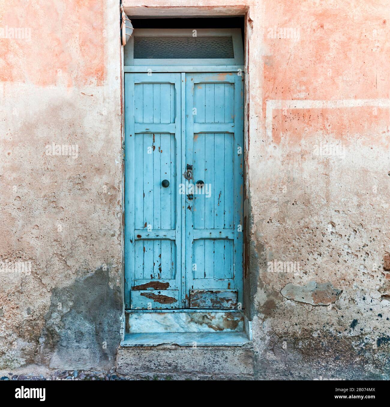 old wooden blue door on the colorful facade Stock Photo - Alamy