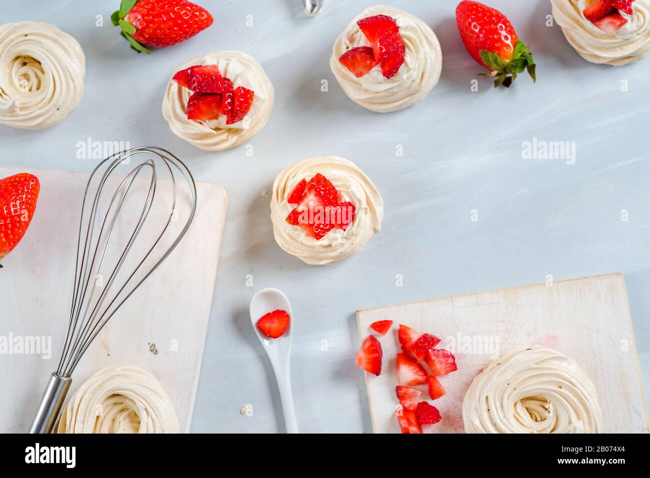 Homemade small strawberry pavlova meringue cakes pattern with cream top