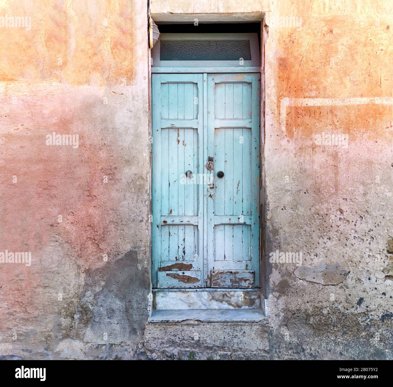 Colorful facade with blue old door Stock Photo - Alamy