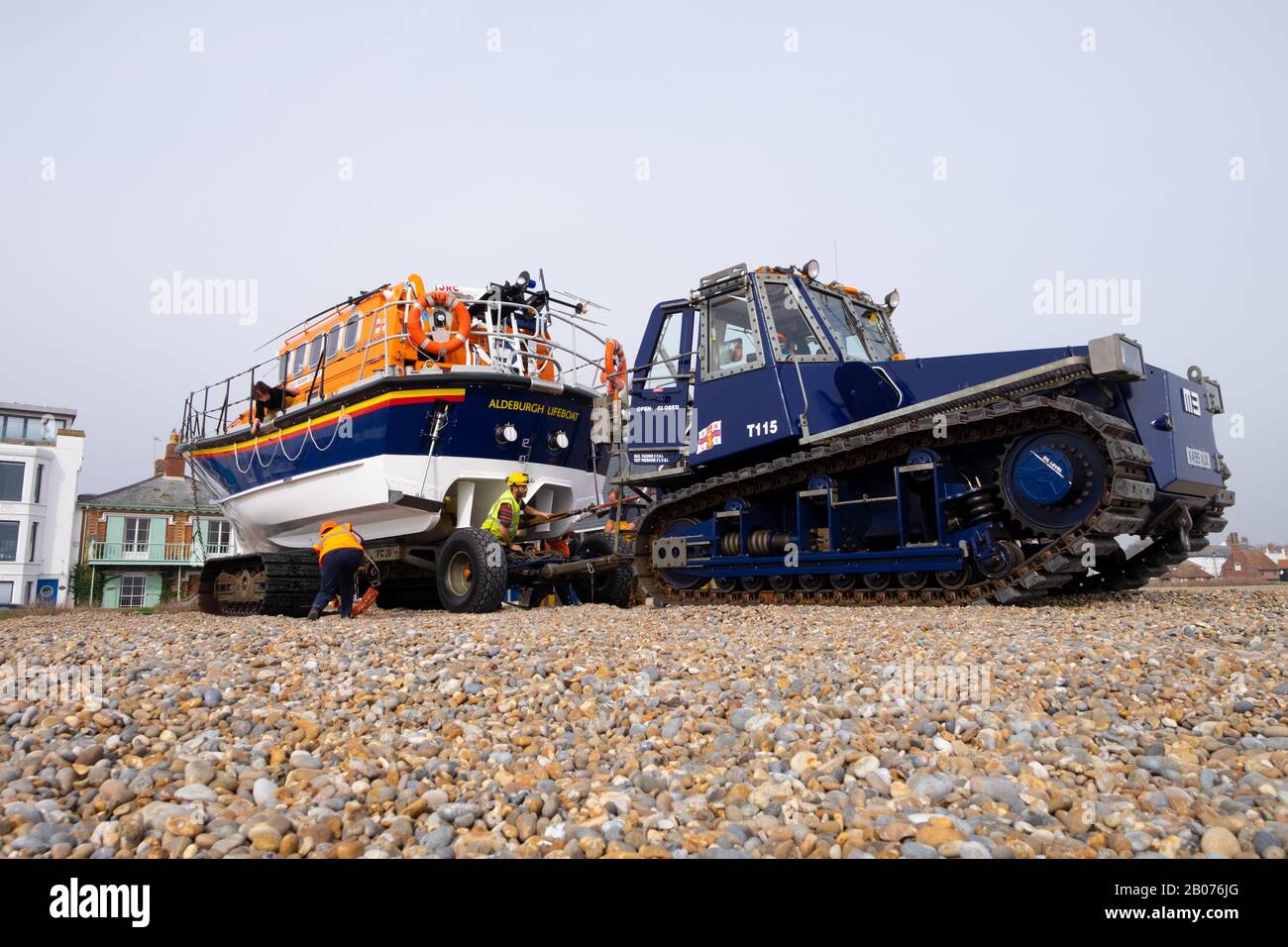 Tractor towing the Aldeburgh lifeboat on the beach ready for launching. Aldeburgh beach, Aldeburgh, Suffolk. UK Stock Photo