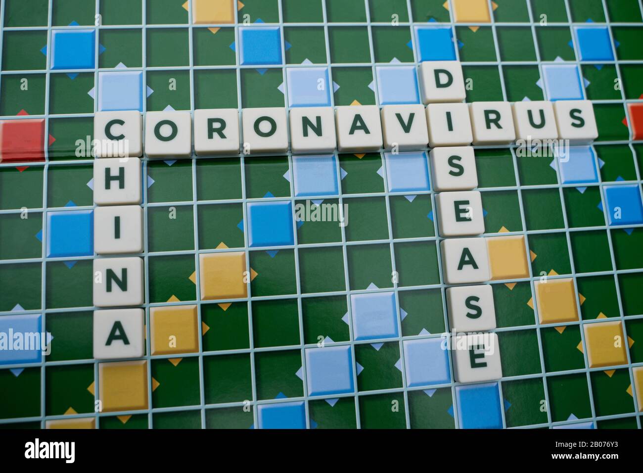 The coronavirus the cold, flu like disease originating in China, set out on a word board with different key phrases used to explain the severity Stock Photo