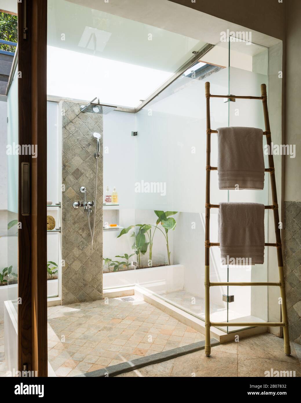 Glass shower protruding into courtyard Stock Photo