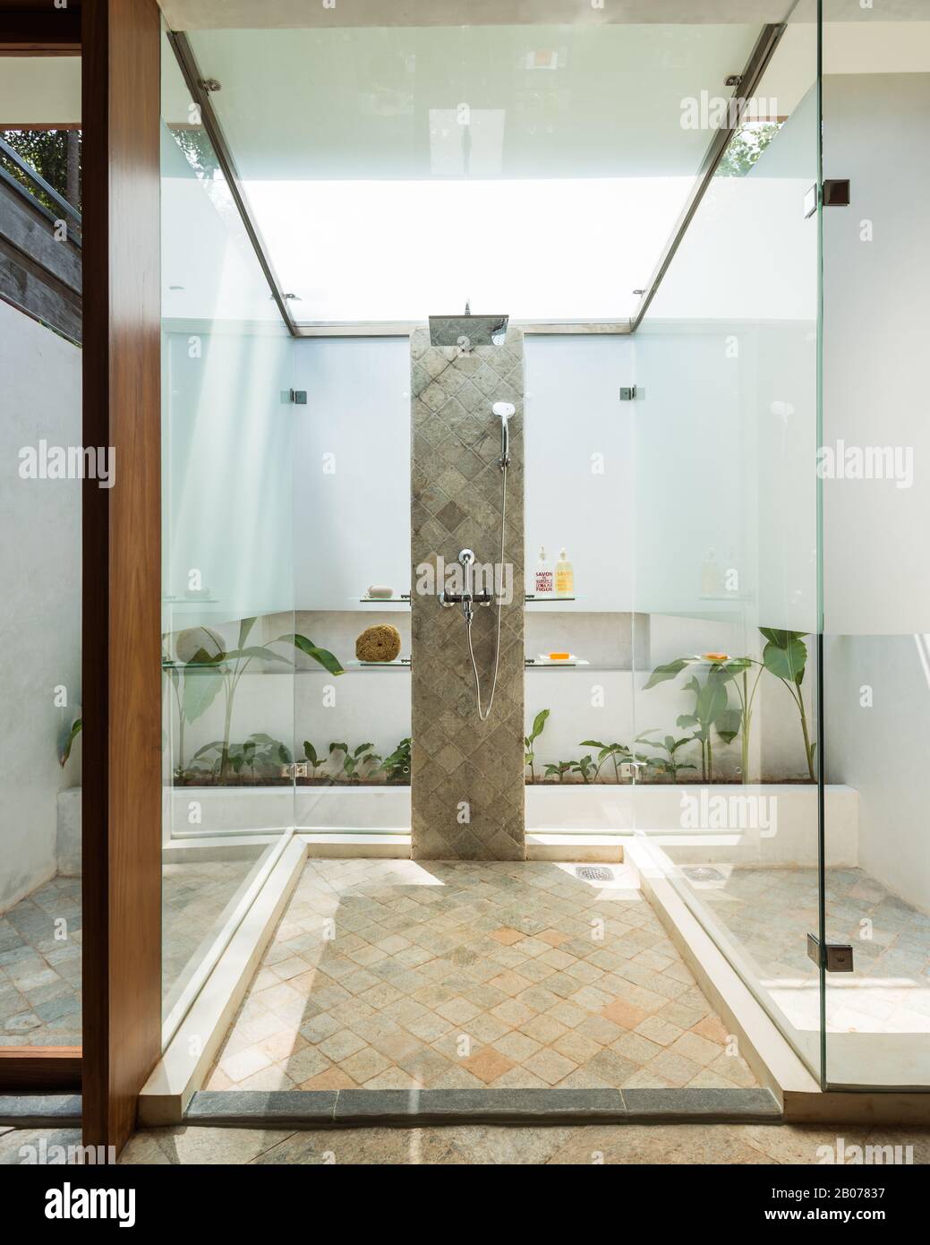 Glass shower protruding into courtyard Stock Photo