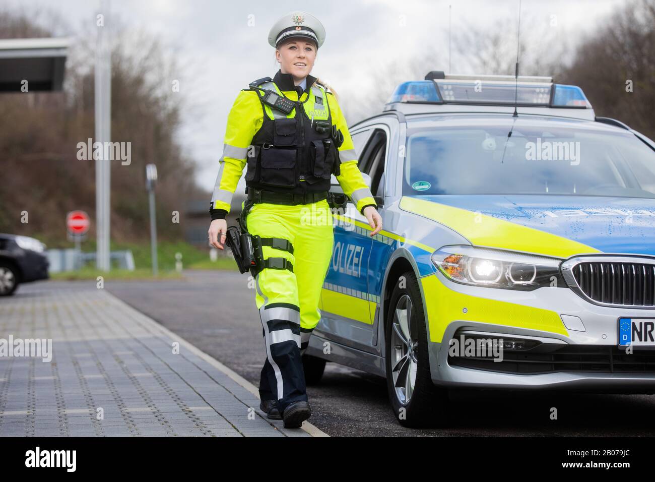 19 February 2020, North Rhine-Westphalia, Mönchengladbach: Police officer  Pia Caspers presents the new uniforms in signal colors for the highway  patrol. Around 1300 police officers are deployed on the motorways. The new
