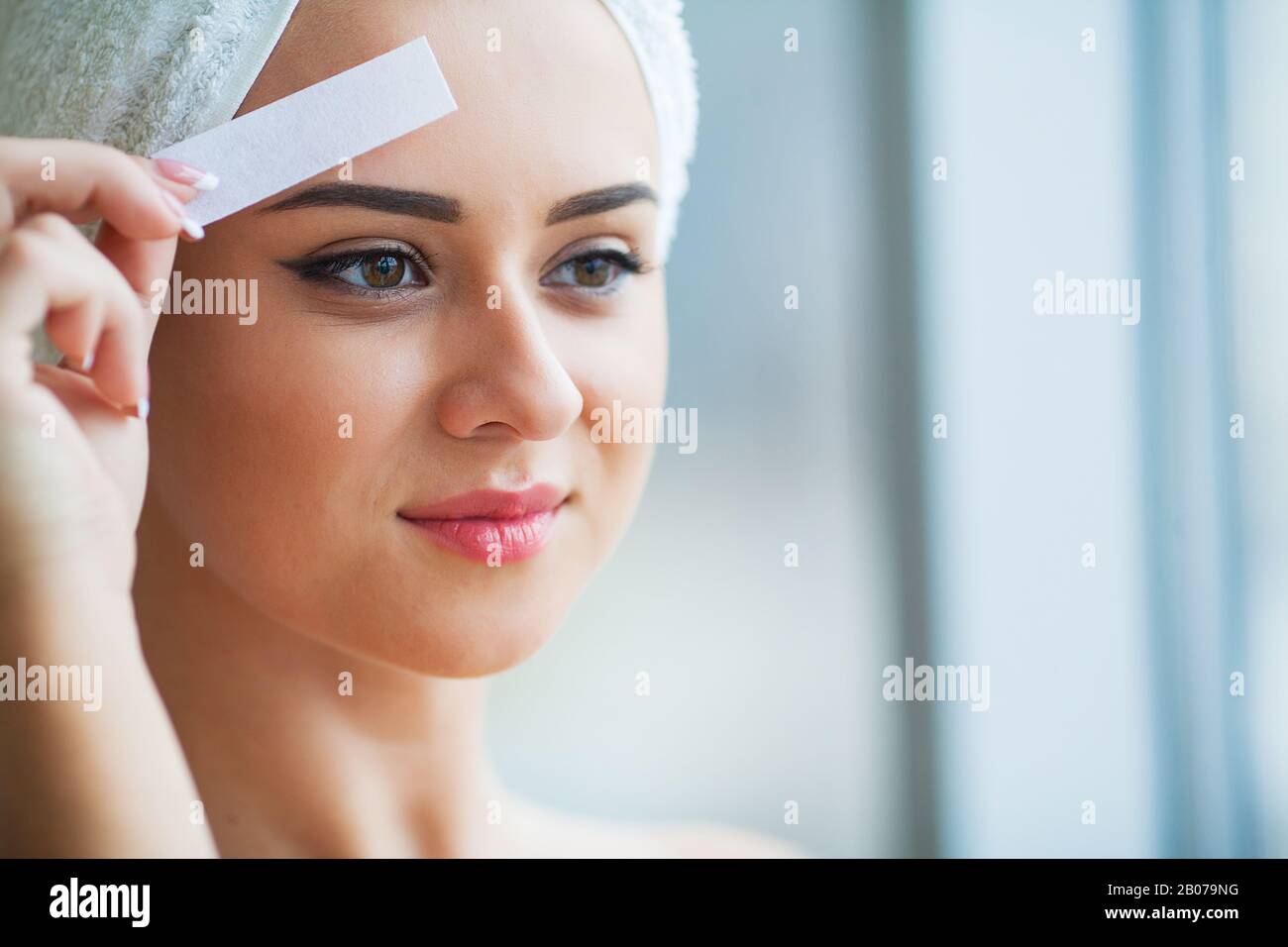 Hair Removal Wax. Young woman reciving facial epilation Stock Photo Alamy