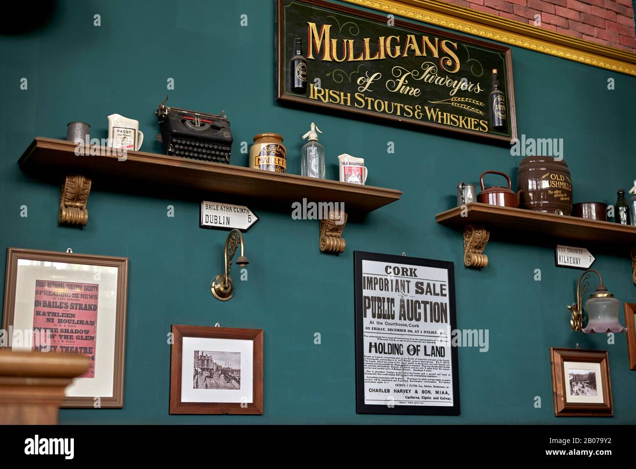 Interior of Mulligans Irish bar Pattaya Thailand with wall display of traditional vintage Irish objects Stock Photo