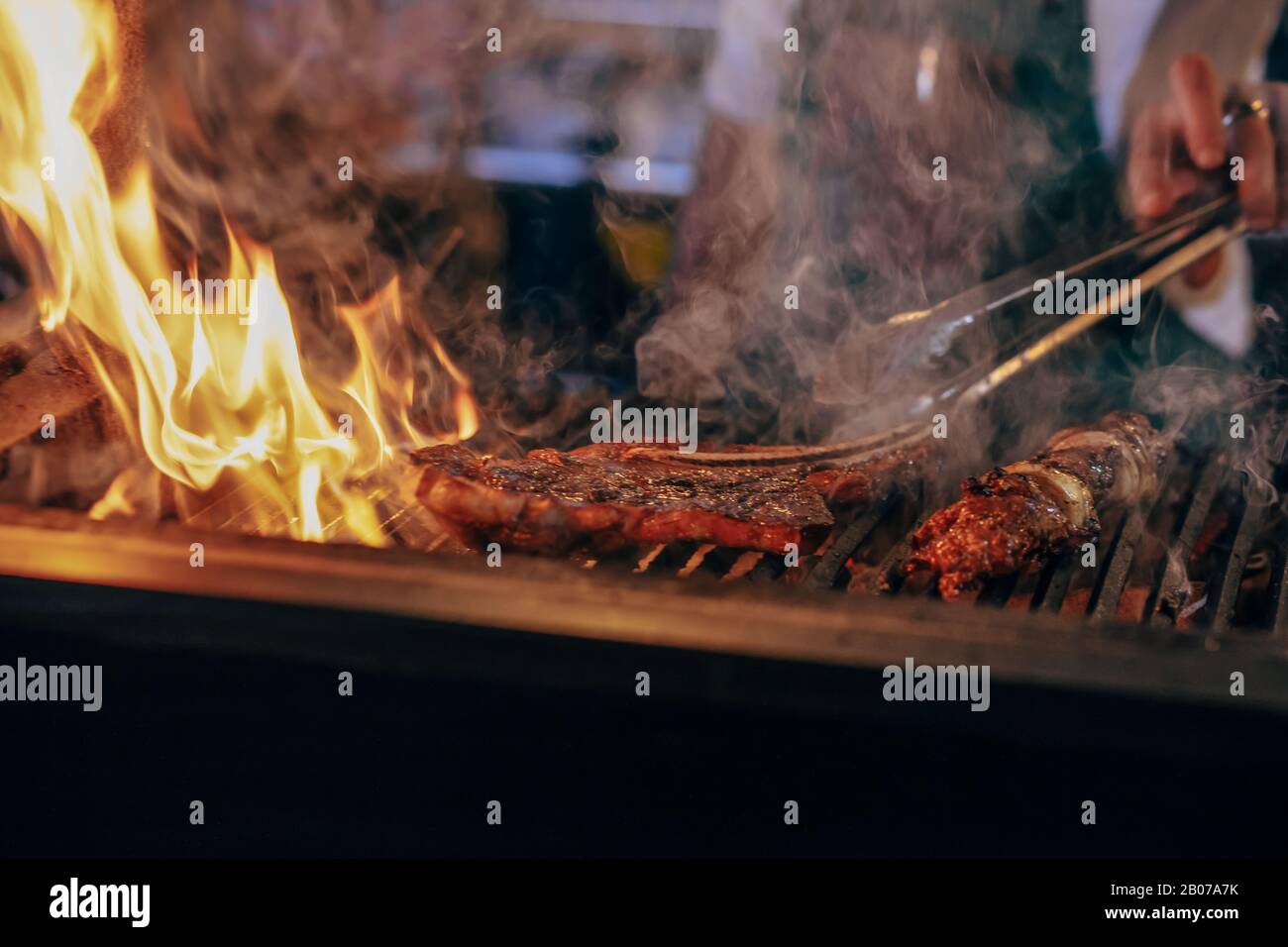 steak is cooking with the fire Stock Photo - Alamy