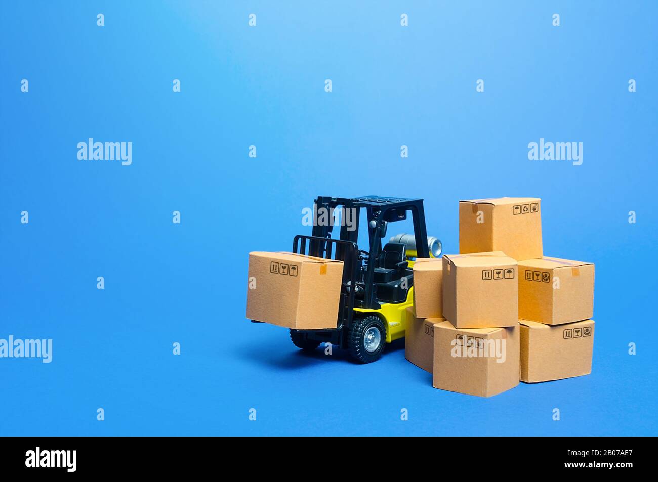 Forklift truck with cardboard boxes. Transportation logistics infrastructure, import and export goods and products delivery. Production, transport, ca Stock Photo