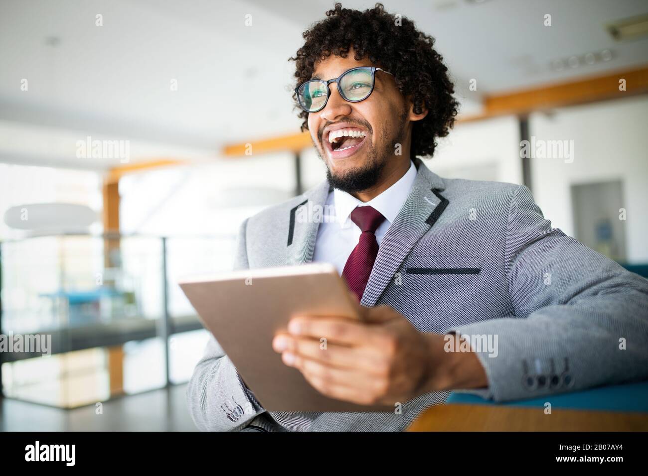 Portrait of man in office using tablet Stock Photo
