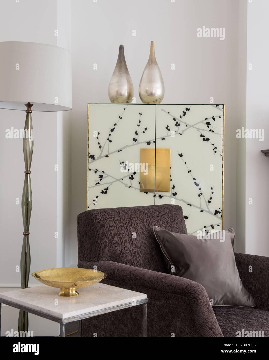 White and gray living room with cupboard Stock Photo Alamy