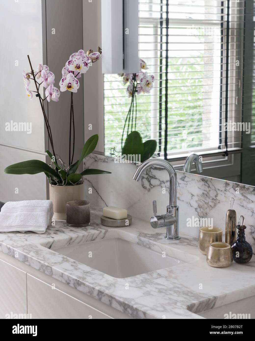 Marble vanity with orchid Stock Photo