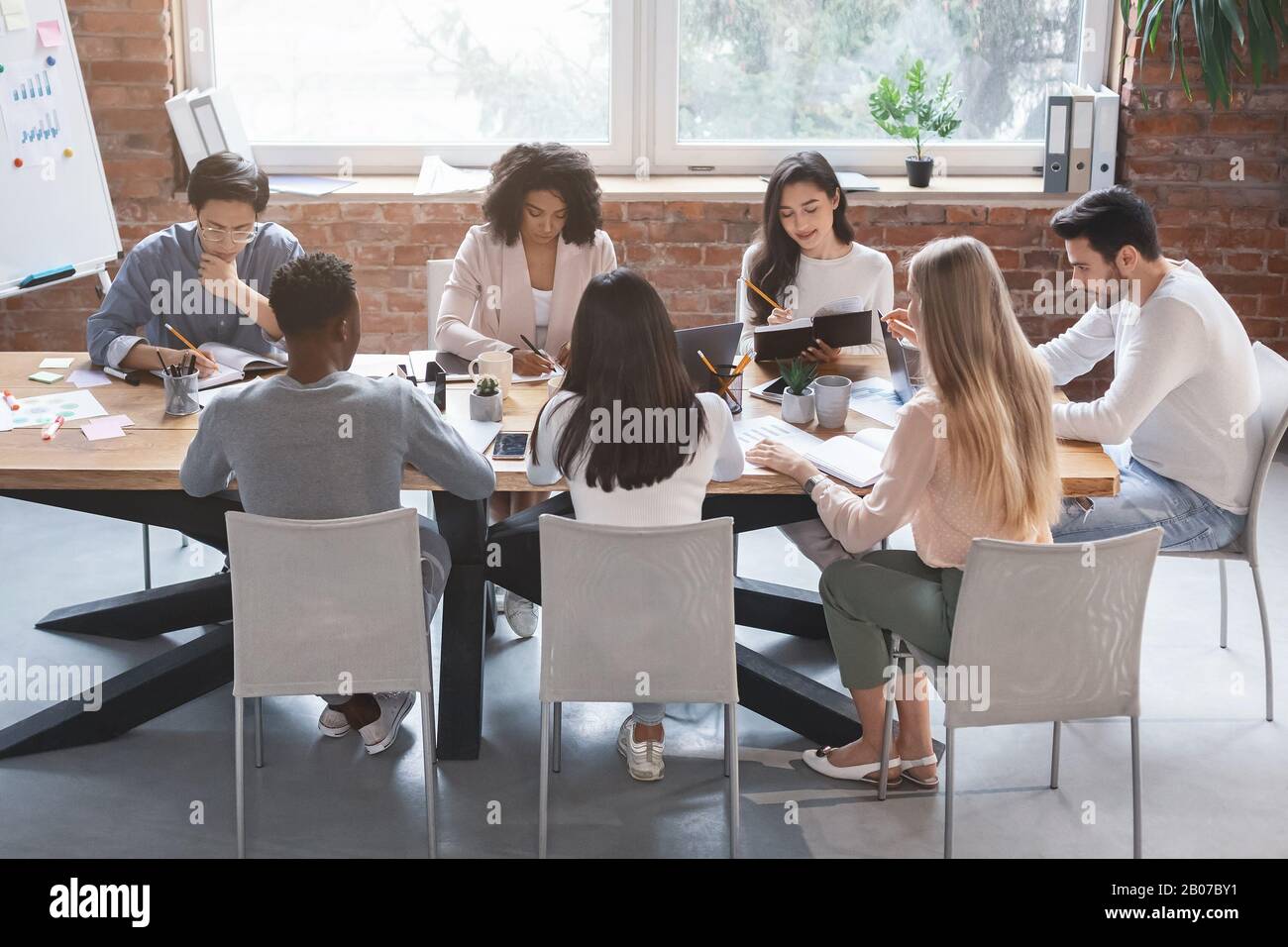 Business meeting of young creative team, office interior Stock Photo