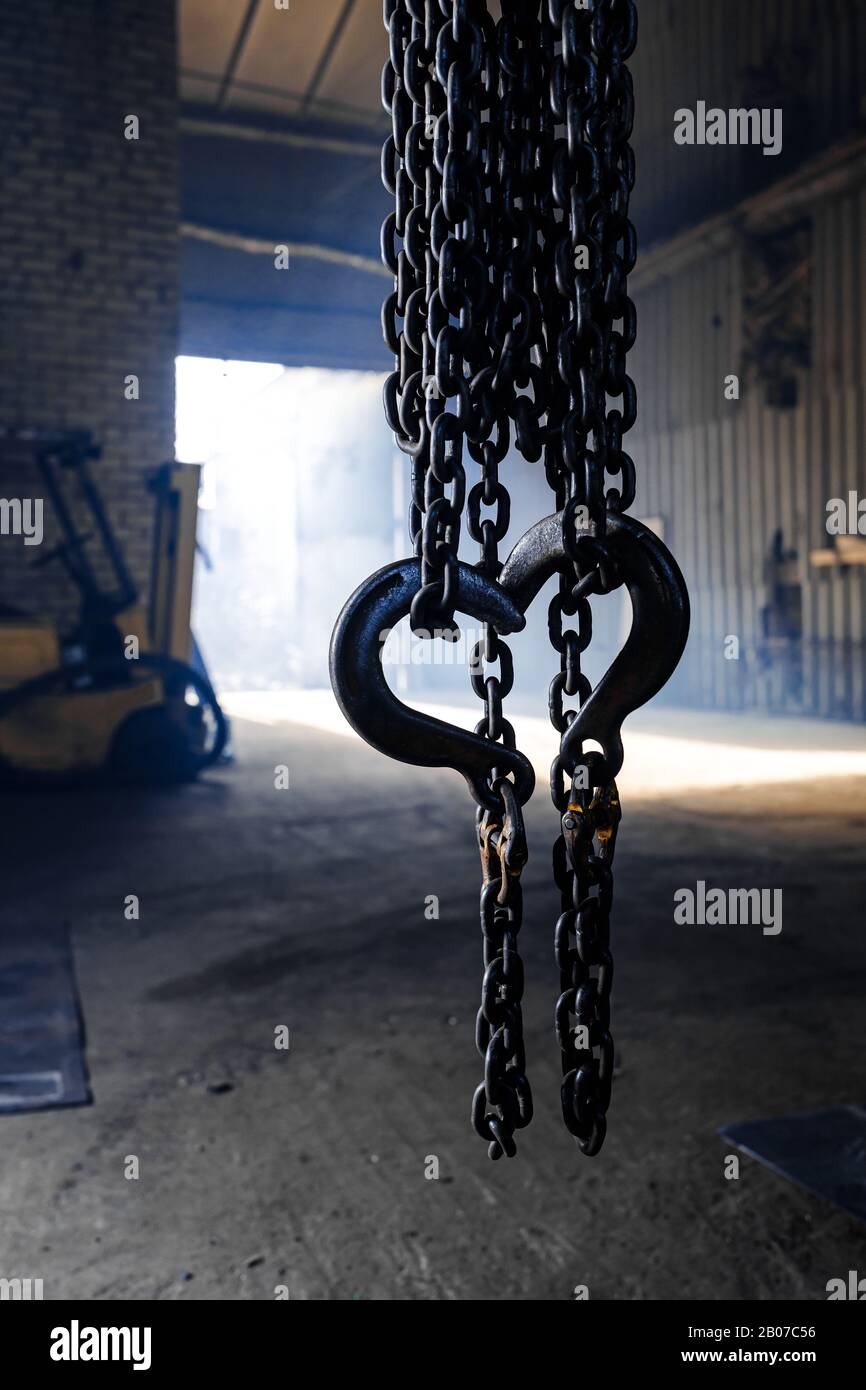 steel chain hook of electric hoist. industrial background Stock Photo