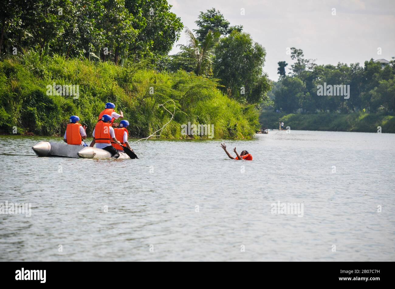 South Tangerang, Indonesia - December 14th, 2014: Volunteers doing water rescue training at the Situ Gintung lake in South Tangerang, Indonesia Stock Photo