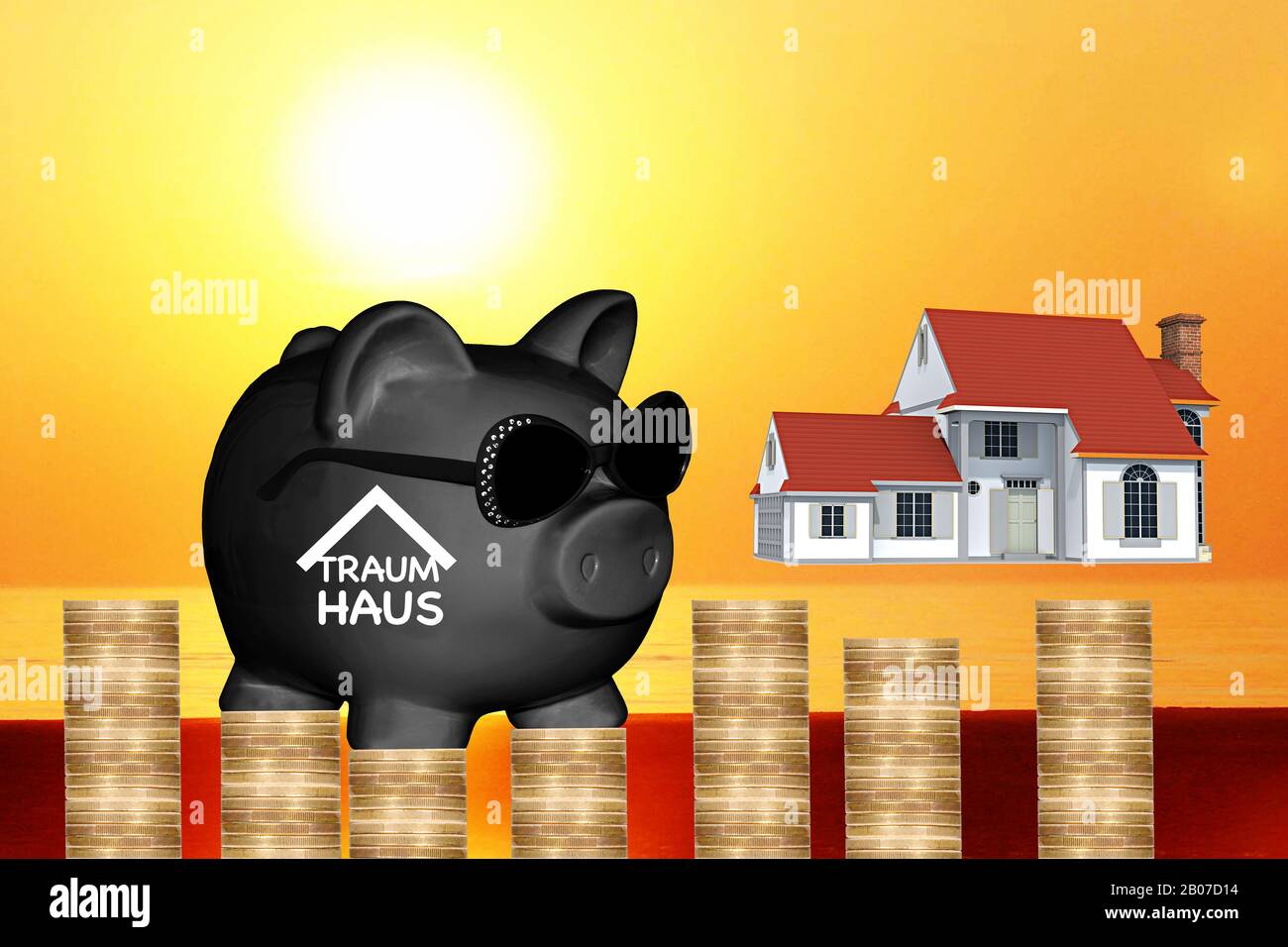 black piggy bank with sun glasses with lettering Traumhaus, dream of owning a house, house, sunset and stack of coins in background, composing Stock Photo