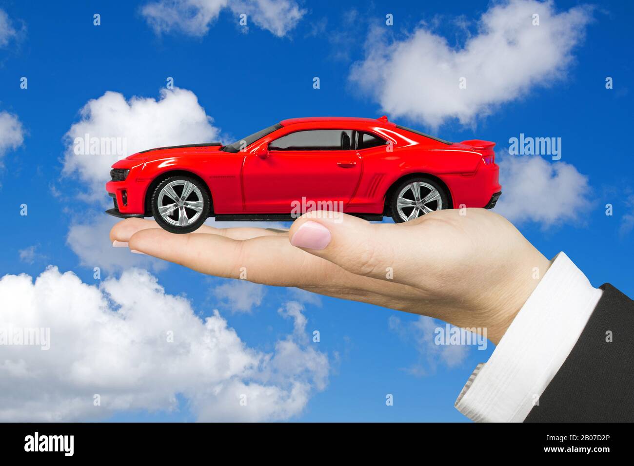 red Chevrolet, Camaro, ZL1, in the hand of a business woman, Bundesrepublik Deutschland Stock Photo