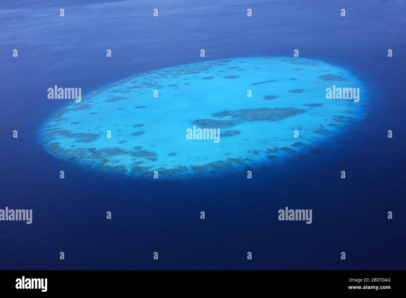 Aerial view of round Tila coral reef in the Maldives Stock Photo - Alamy