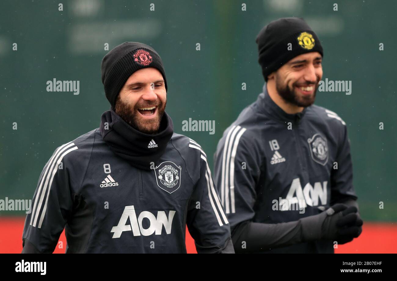 Manchester United's Juan Mata (left) and Bruno Fernandes share a joke during the training session at the Aon Training Complex, Manchester. Stock Photo