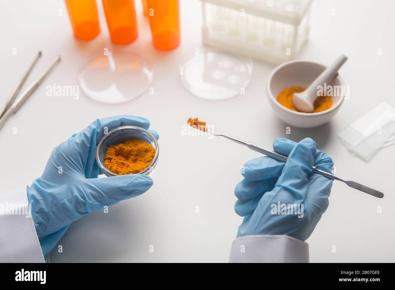 Scientist making Lab research of curcuma impact on health Stock Photo