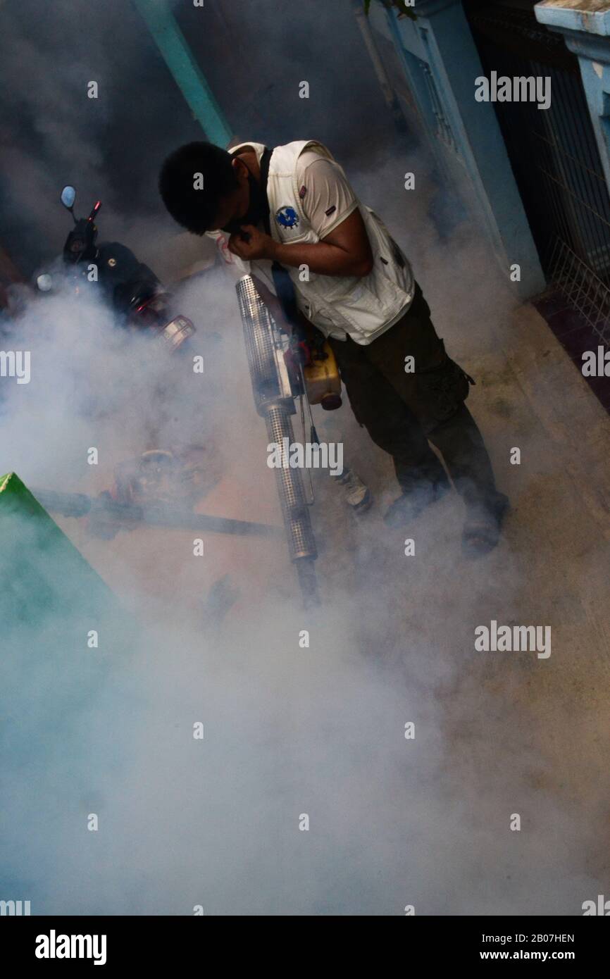 Jakarta, Indonesia - November 5th, 2020: Smoke fogging by to kill dengue Aedes aegypti mosquito or to prevent Zika viruses using blowing machine Stock Photo