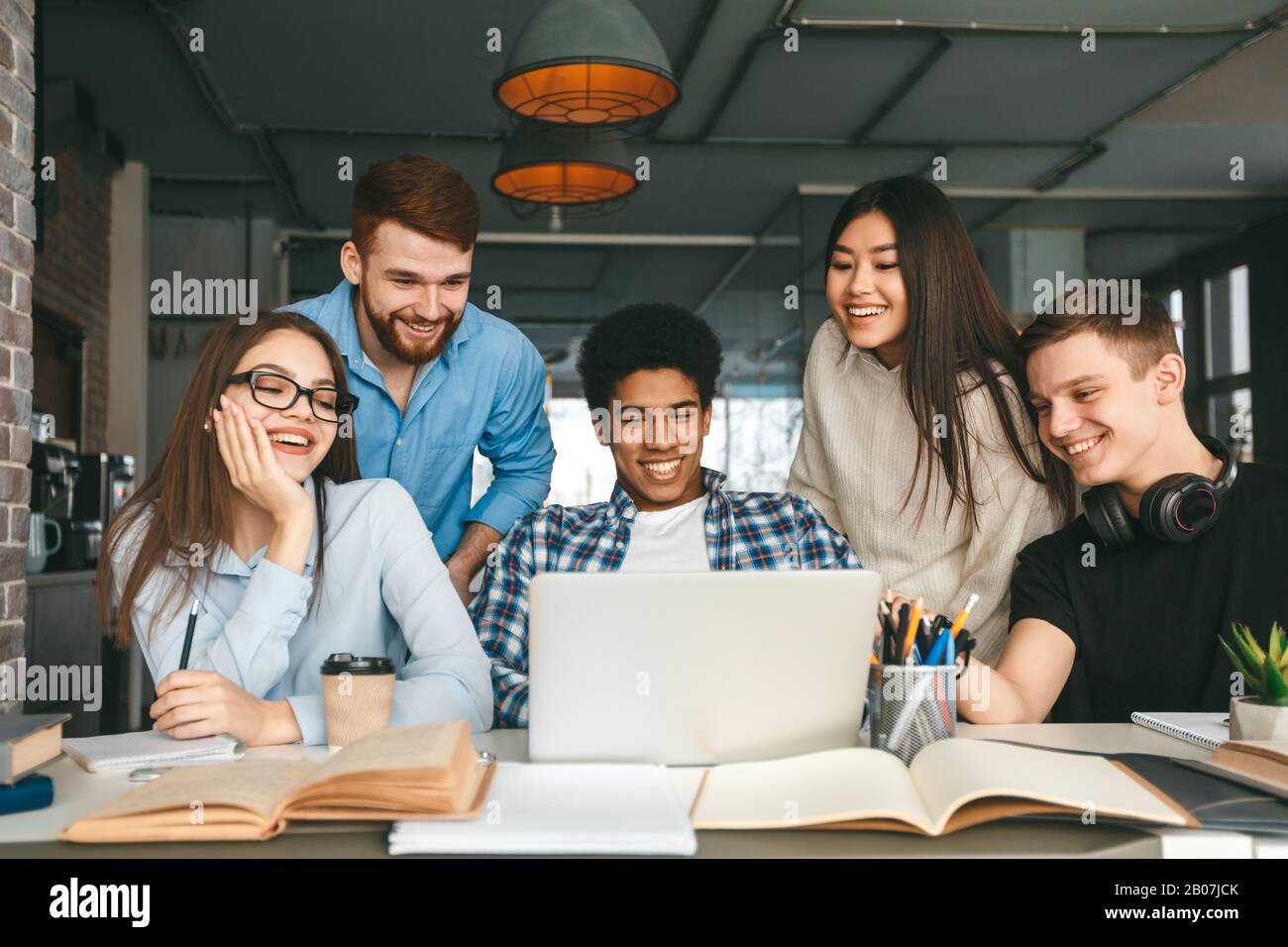 Education concept. Multinational teens enjoying group study Stock Photo