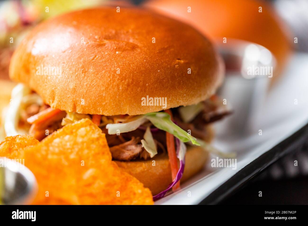 BBQ pulled pork sandwich with coleslaw on brioche buns Stock Photo Alamy