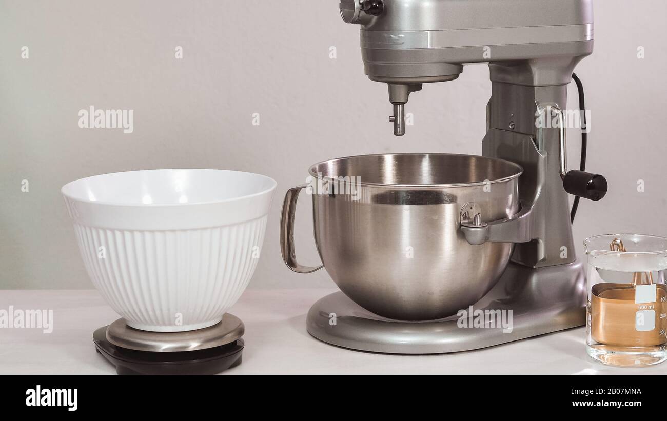 Step by step. Flat lay. Mixing royal icing in electric kitchen mixer