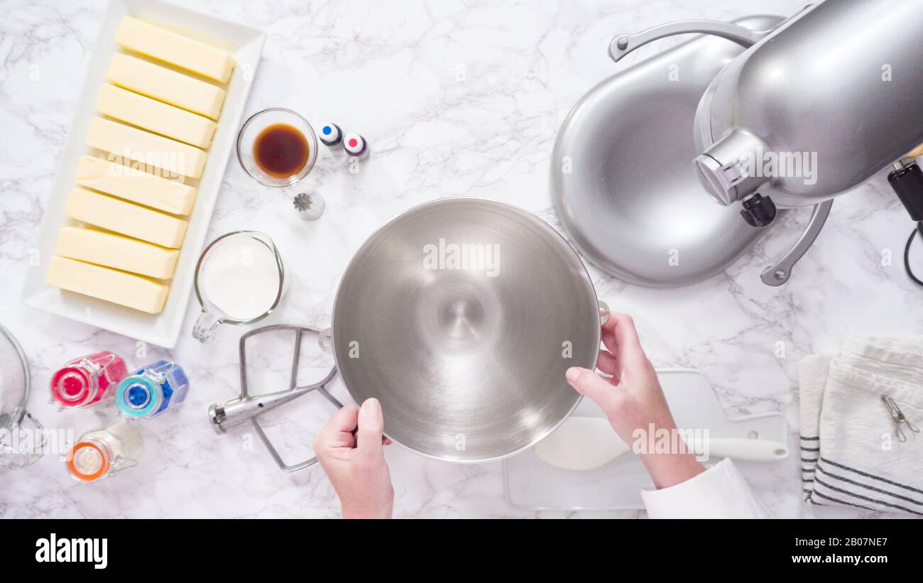 Mixing ingredients in standing kitchen mixer to make buttercream