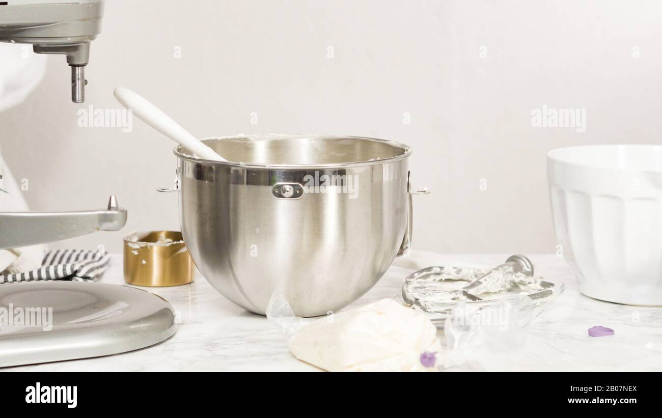 Mixing ingredients in standing kitchen mixer to make buttercream