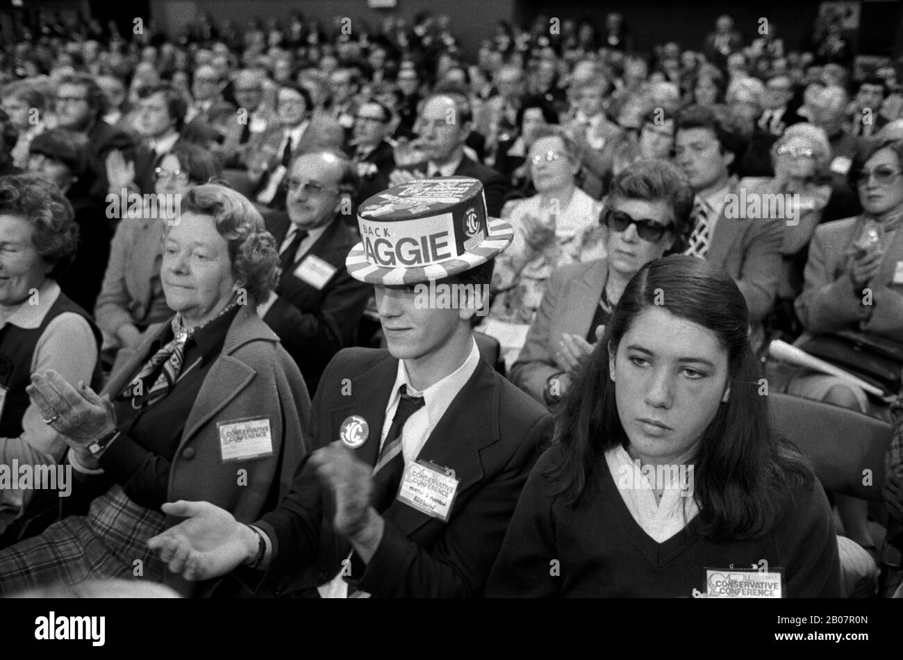 UK Young Conservatives 1980s. Young adult man applauds Maggie Mrs Margaret Thatcher at the Brighton Conservative Party Conference 1981. He is wearing a 'Back Maggie', party conference hat. Strike back with the Tories was the party slogan. England  HOMER SYKES Stock Photo