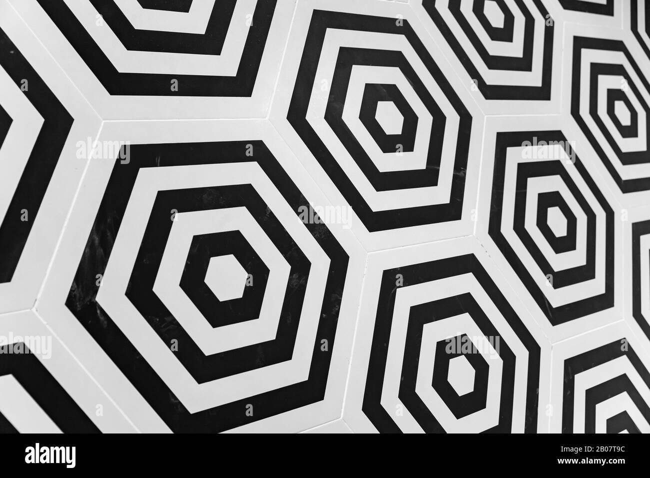 Modern hexagonal wall tiling background, abstract geometric black and white pattern Stock Photo
