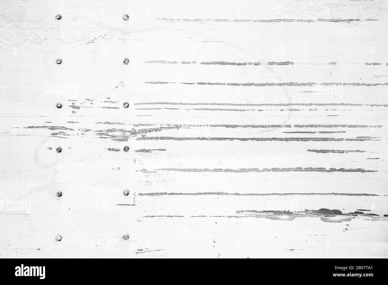 Texture of white scratched metal wall with rivets. Abstract background photo Stock Photo